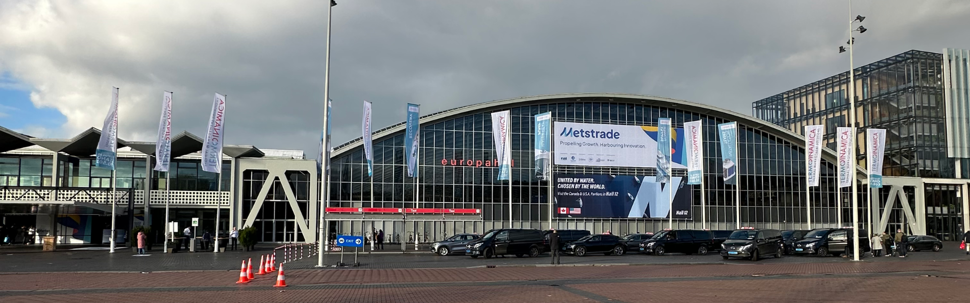 Exterior view of RAI Amsterdam during METSTRADE 2025 with event banners and attendees outside the Europahal entrance.