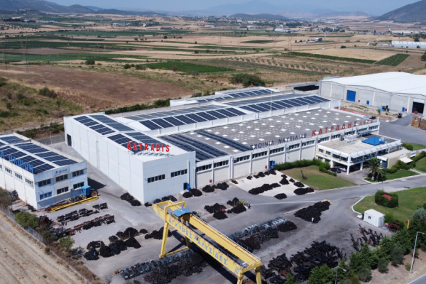 Aerial view of Katradis S.A. rope manufacturing and storage facility with solar panels and outdoor anchor yard in Greece.